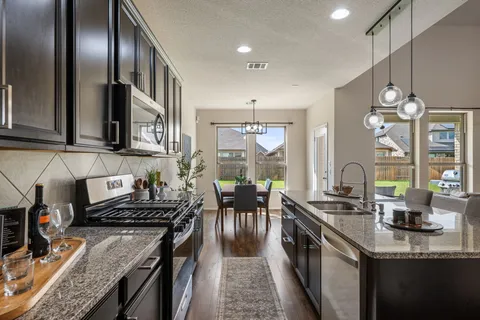 a dining room with furniture window and wooden floor