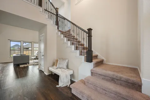 a room with furniture and potted plant