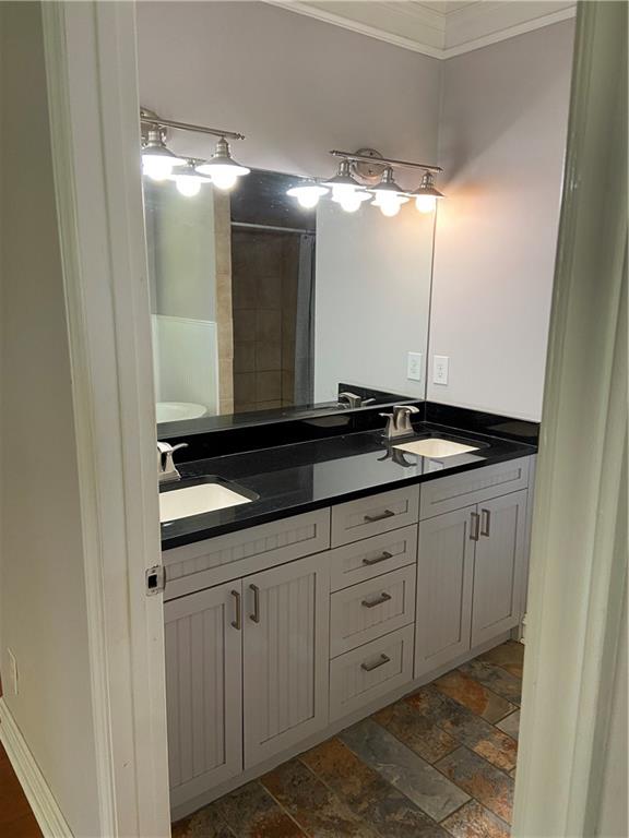 6175 Jett Road Dawsonville, GA 30534 - Photo 16 of 60 a bathroom with a double vanity sink and mirror