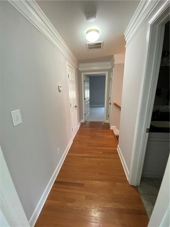 6175 Jett Road Dawsonville, GA 30534 - Photo 18 of 60 a view of a hallway with wooden floor and staircase