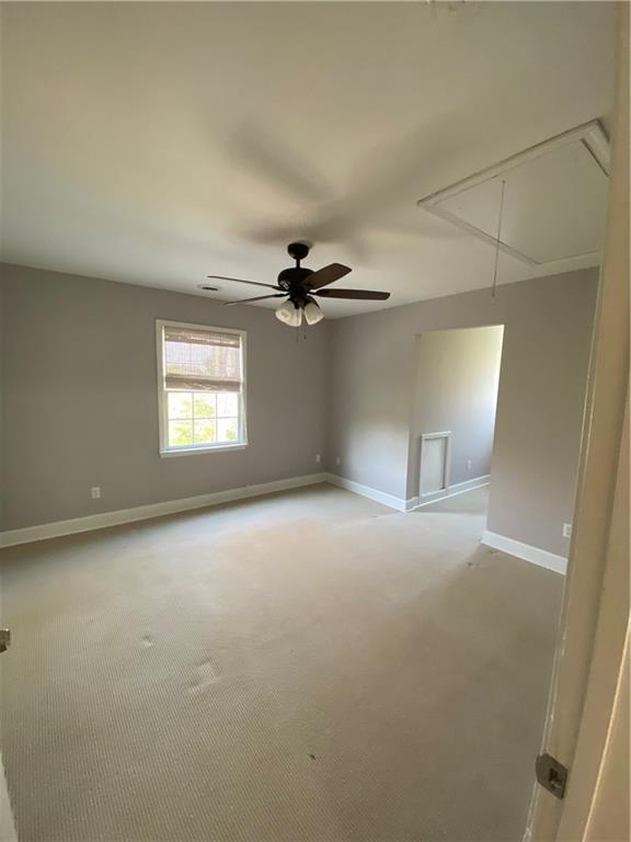6175 Jett Road Dawsonville, GA 30534 - Photo 19 of 60 a view of a livingroom with a ceiling fan and window