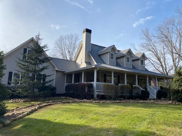 6175 Jett Road Dawsonville, GA 30534 - Photo 2 of 60 a view of a house with a swimming pool