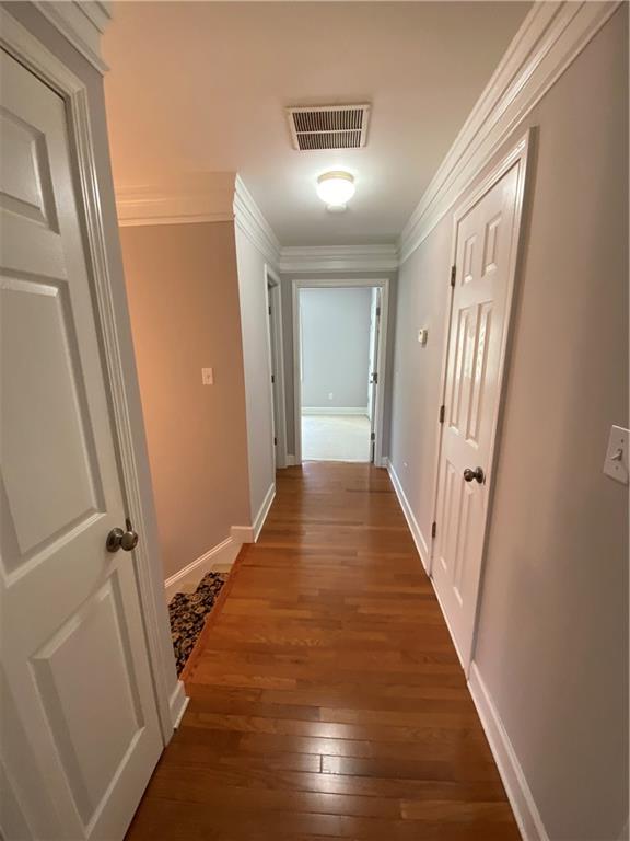 6175 Jett Road Dawsonville, GA 30534 - Photo 21 of 60 a view of a hallway with wooden floor and staircase