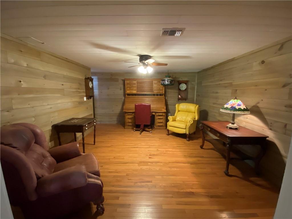 6175 Jett Road Dawsonville, GA 30534 - Photo 28 of 60 a bedroom with furniture and wooden floor