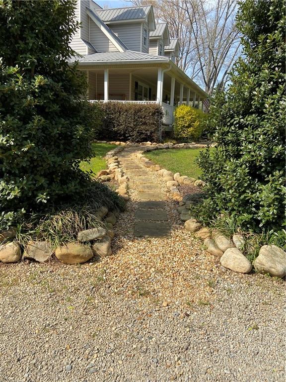 6175 Jett Road Dawsonville, GA 30534 - Photo 4 of 60 a view of a house with a yard covered in snow