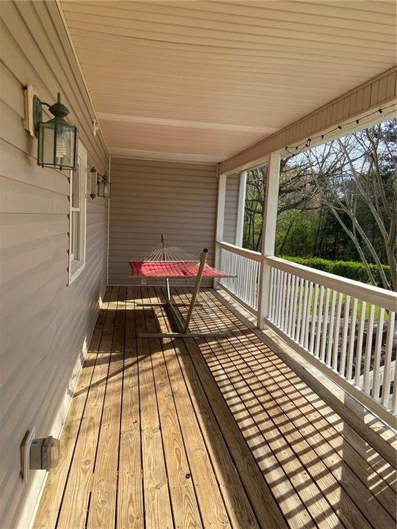 6175 Jett Road Dawsonville, GA 30534 - Photo 46 of 60 a balcony with wooden floor and next to a window
