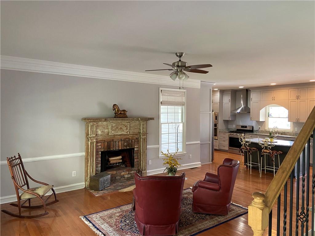 6175 Jett Road Dawsonville, GA 30534 - Photo 5 of 60 a living room with furniture pool table and a fireplace