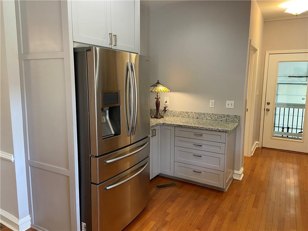 6175 Jett Road Dawsonville, GA 30534 - Photo 9 of 60 a kitchen with granite countertop stainless steel appliances and a refrigerator