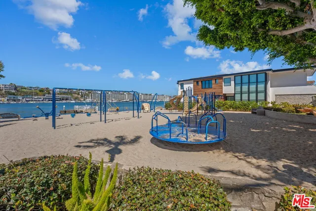 a view of a swimming pool and lounge chairs