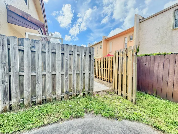 a sign that is on a brick wall