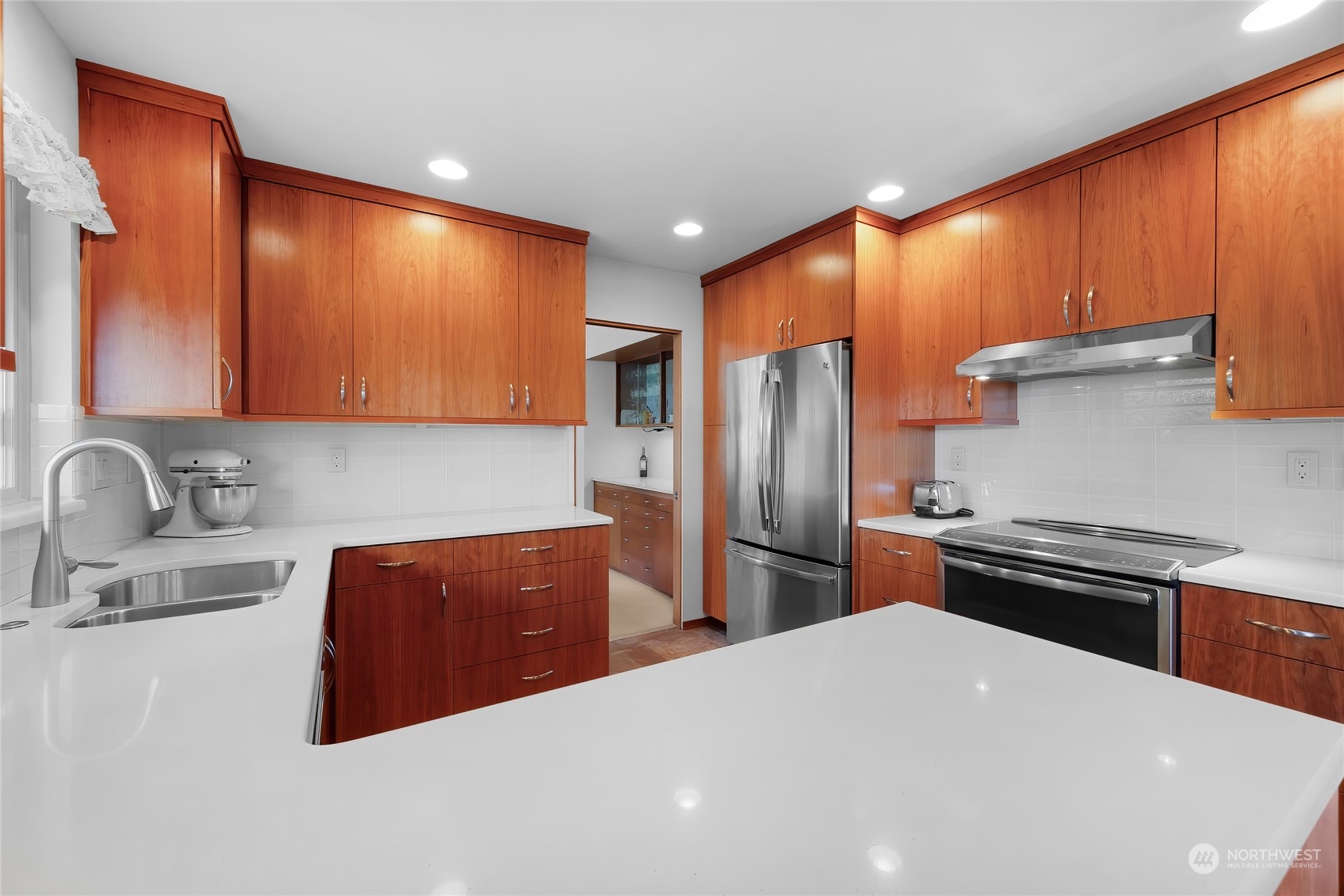 4630 View Drive Everett, WA 98203 - Photo 13 of 40 a kitchen with stainless steel appliances a refrigerator sink and stove