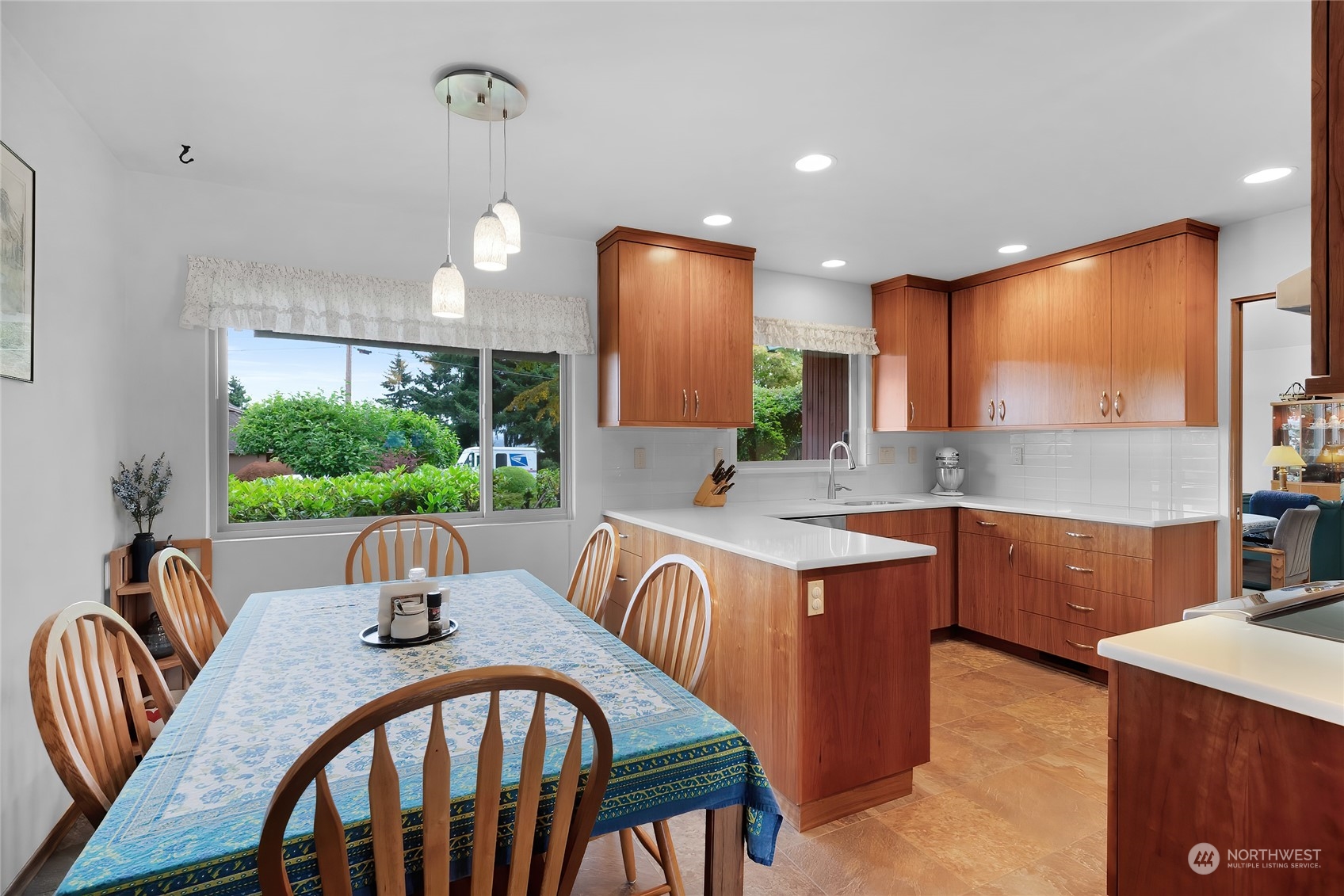 4630 View Drive Everett, WA 98203 - Photo 14 of 40 a view of a dining room with furniture a chandelier and wooden floor