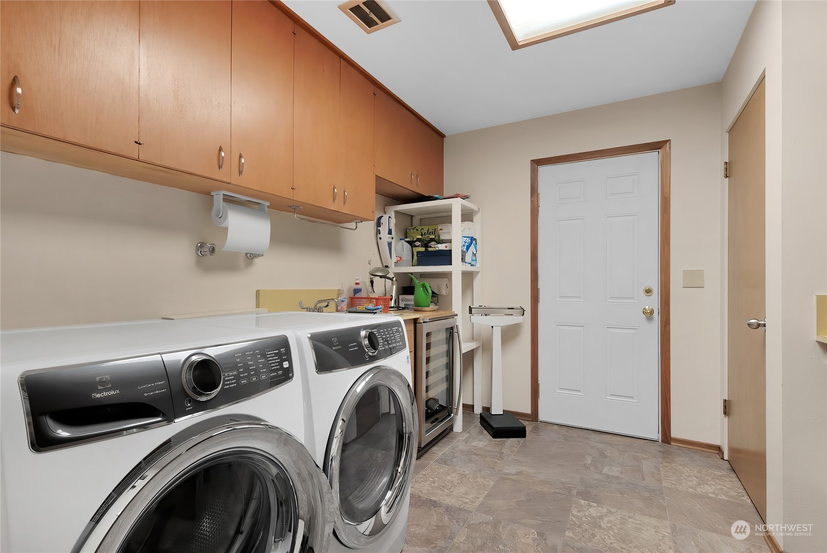 4630 View Drive Everett, WA 98203 - Photo 17 of 40 a view of storage and utility room with washer and dryer