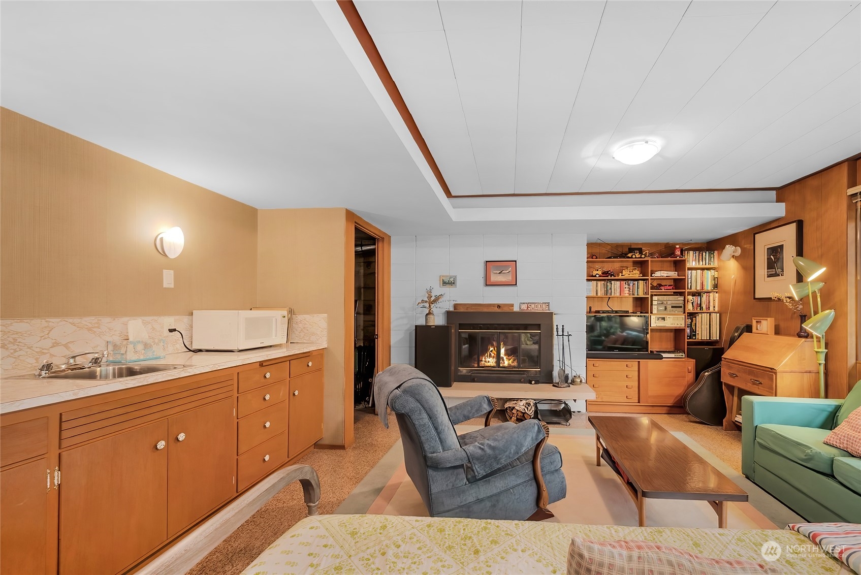 4630 View Drive Everett, WA 98203 - Photo 28 of 40 a living room with furniture a fireplace and a large window