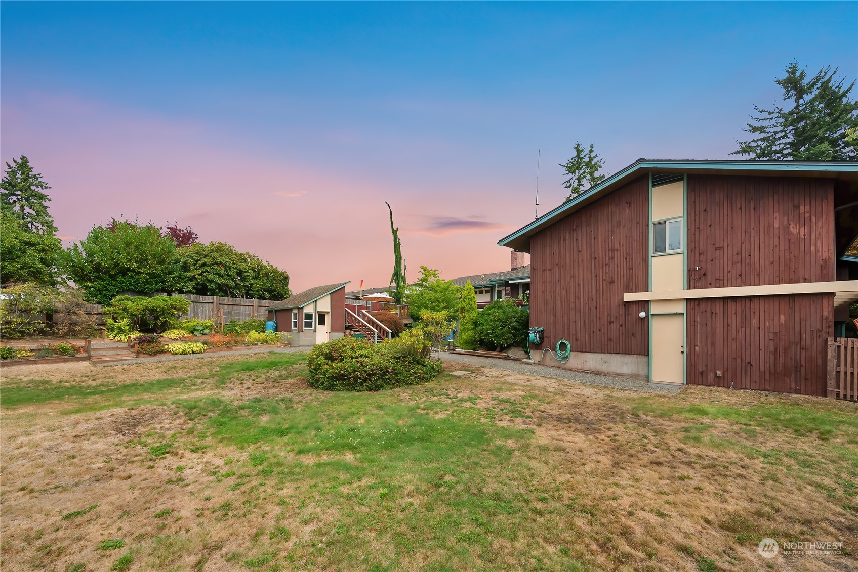 4630 View Drive Everett, WA 98203 - Photo 40 of 40 a backyard of a house with lots of green space