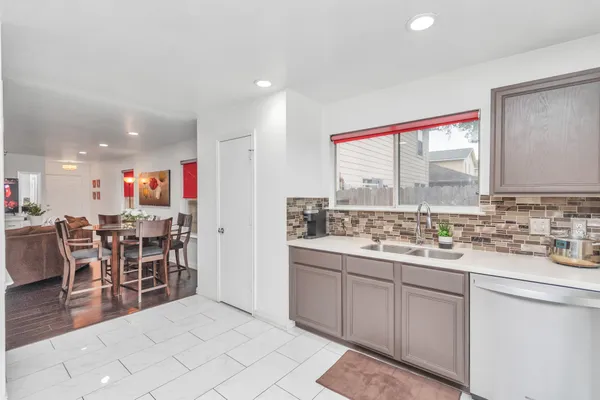 a kitchen with a sink and wooden cabinets