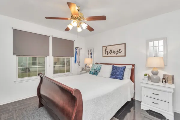 a bedroom with a large bed and a window