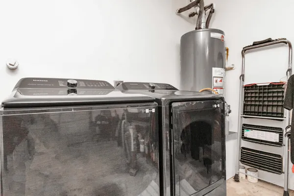a utility room with washer and dryer