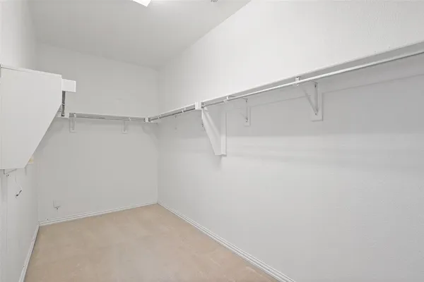 a view of an empty walk in closet