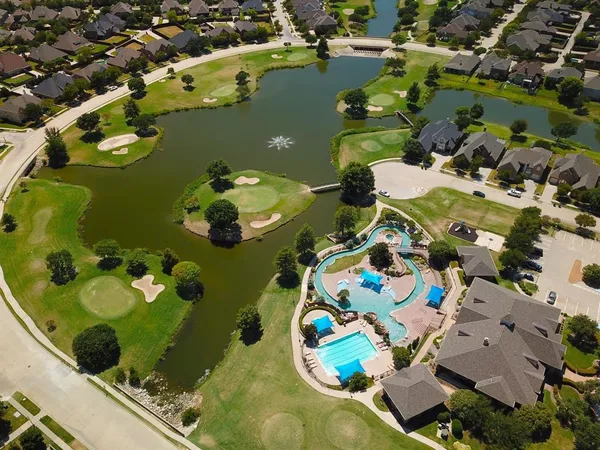 a swimming pool with chairs