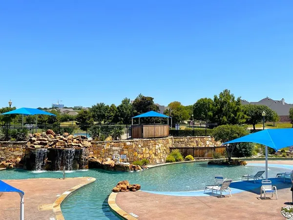 an aerial view of a house with outdoor space