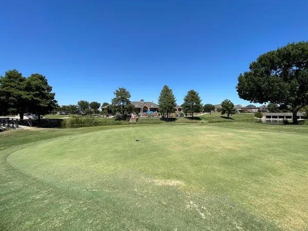 a living room with fireplace furniture and a wooden floor