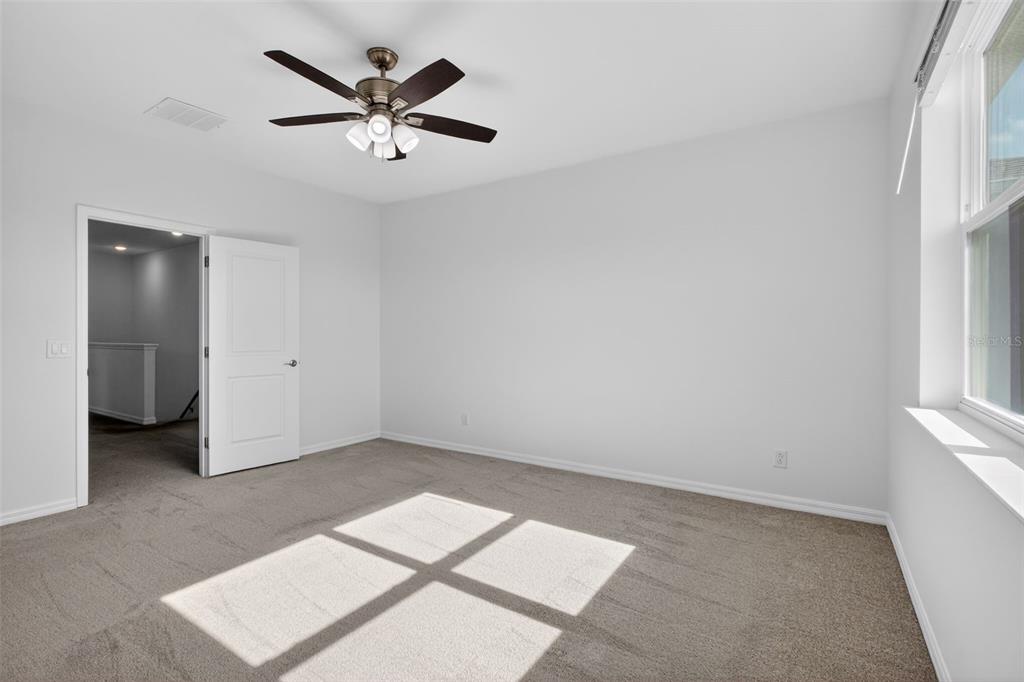 810 MIDDLETON Street DeBary, FL 32713 - Photo 39 of 52 an empty room with ceiling fan and window