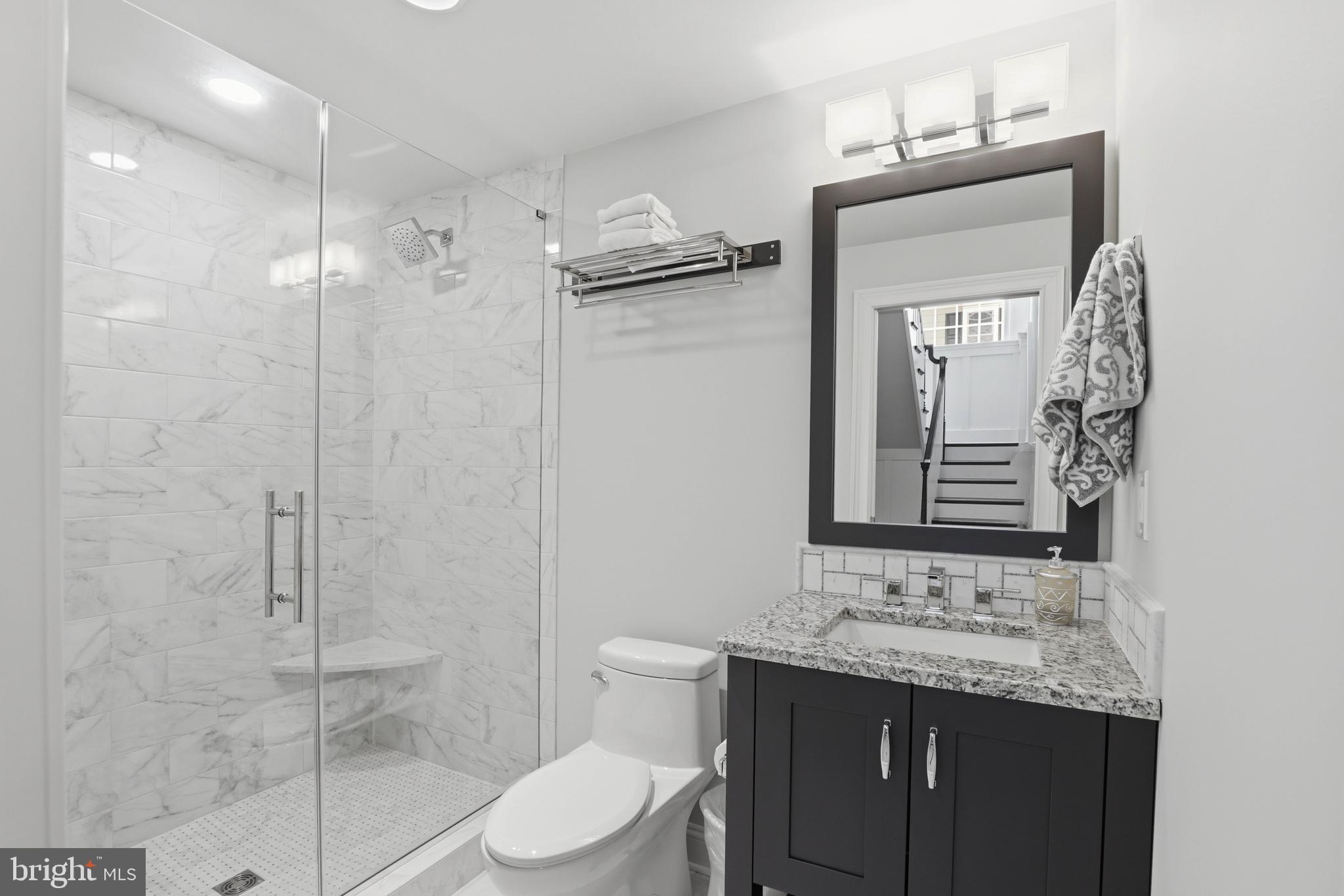 360 Addison Place Lancaster, PA 17601 - Photo 56 of 78 a bathroom with a granite countertop sink toilet and shower