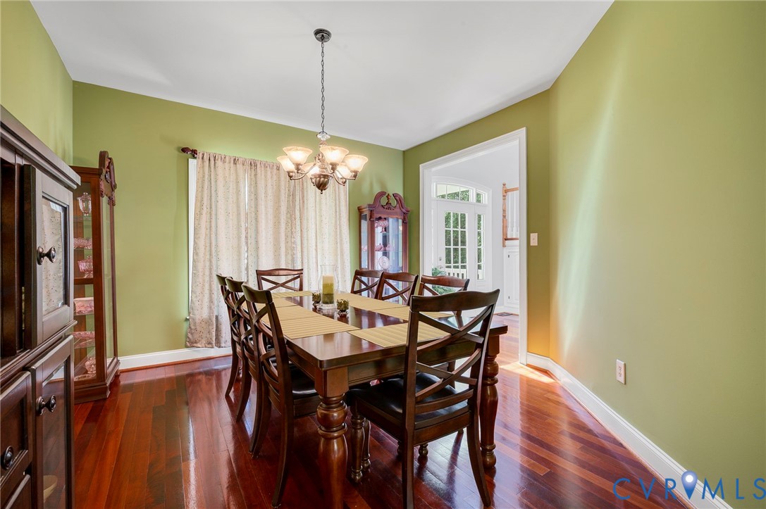 17170 Templeton Road Disputanta, VA 23842 - Photo 6 of 27 a view of a dining room with furniture window and wooden floor