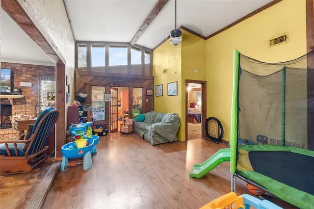 a bedroom with furniture and window