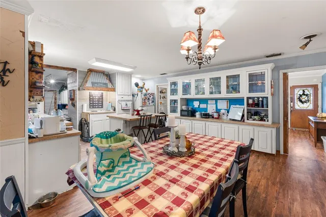 a open kitchen with a table and chairs in it