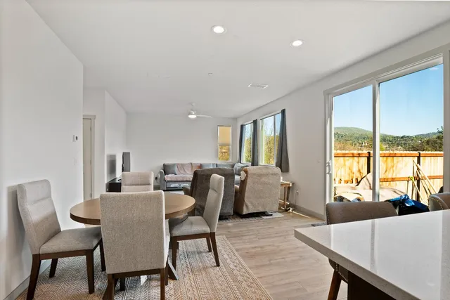 a view of a dining room with furniture window and outside view
