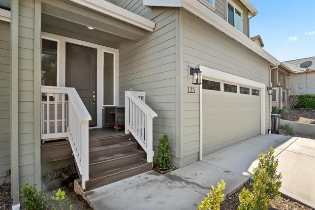 a view of a house with wooden fence
