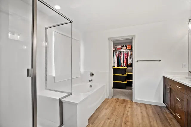 a view of walk in closet with empty racks