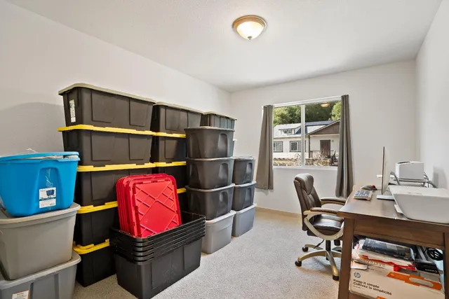 a workspace with furniture and window