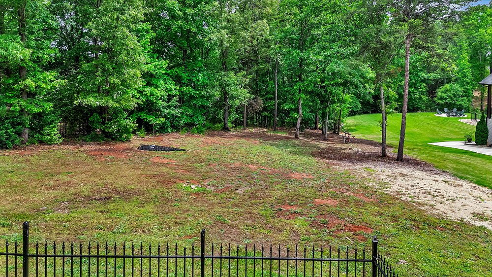 109 Limelight Drive Anderson, SC 29621 - Photo 2 of 34 This spacious yard offers a serene retreat with lush trees and ample room for outdoor enjoyment.