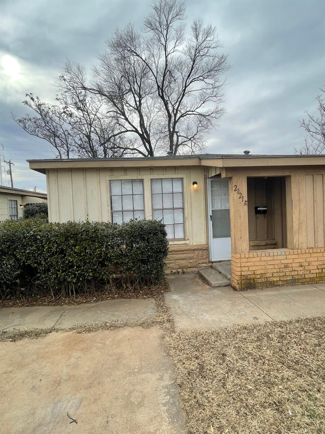 a view of a house with a yard and garage