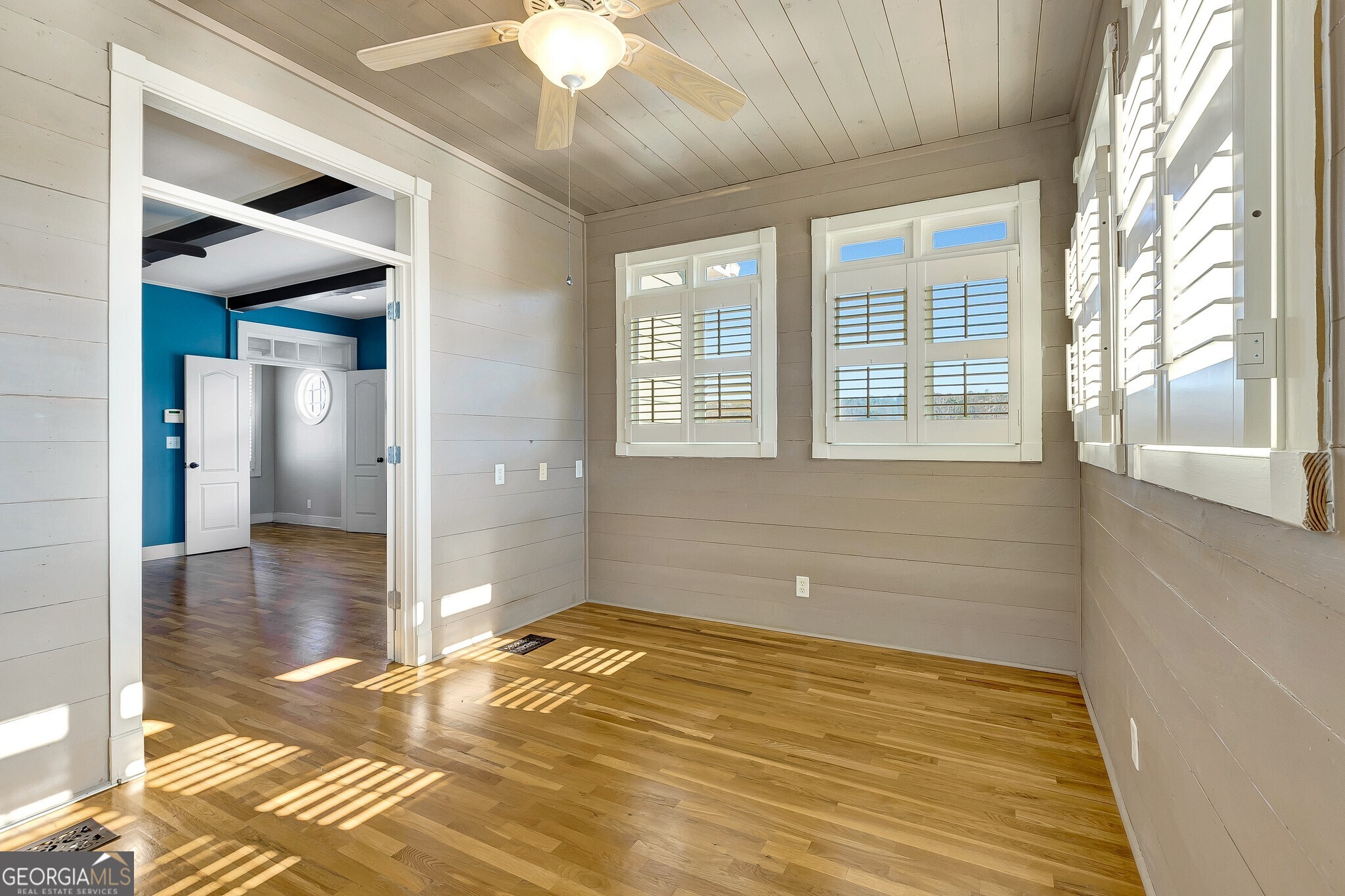 220 Joe Roberts Road Newnan, GA 30263 - Photo 51 of 108 a view of an empty room with wooden floor and a window