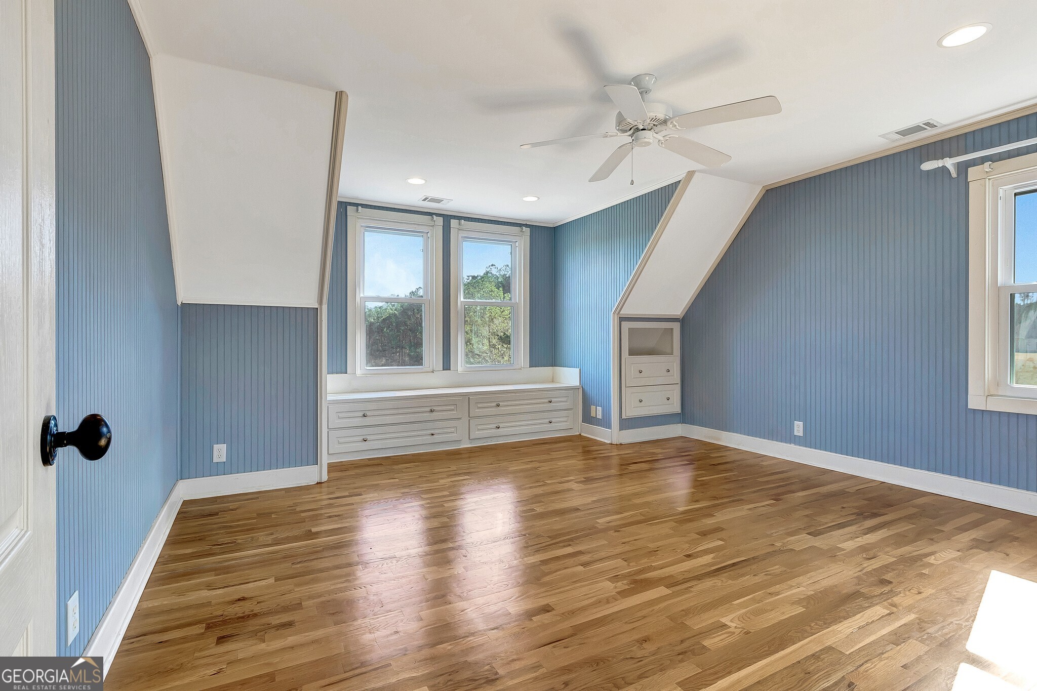 220 Joe Roberts Road Newnan, GA 30263 - Photo 60 of 108 a view of an empty room with a window and wooden floor