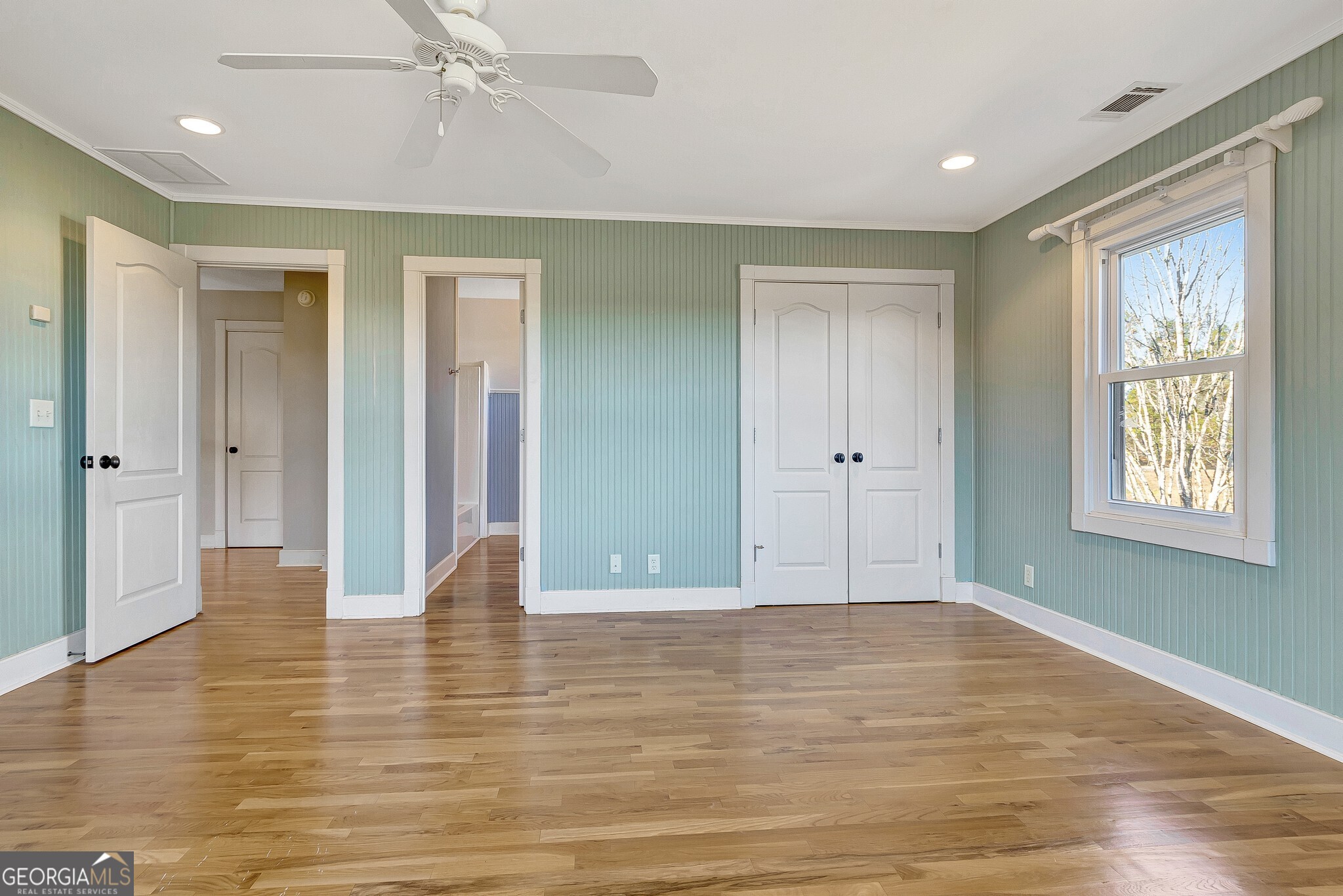 220 Joe Roberts Road Newnan, GA 30263 - Photo 64 of 108 a view of an empty room with wooden floor and a window