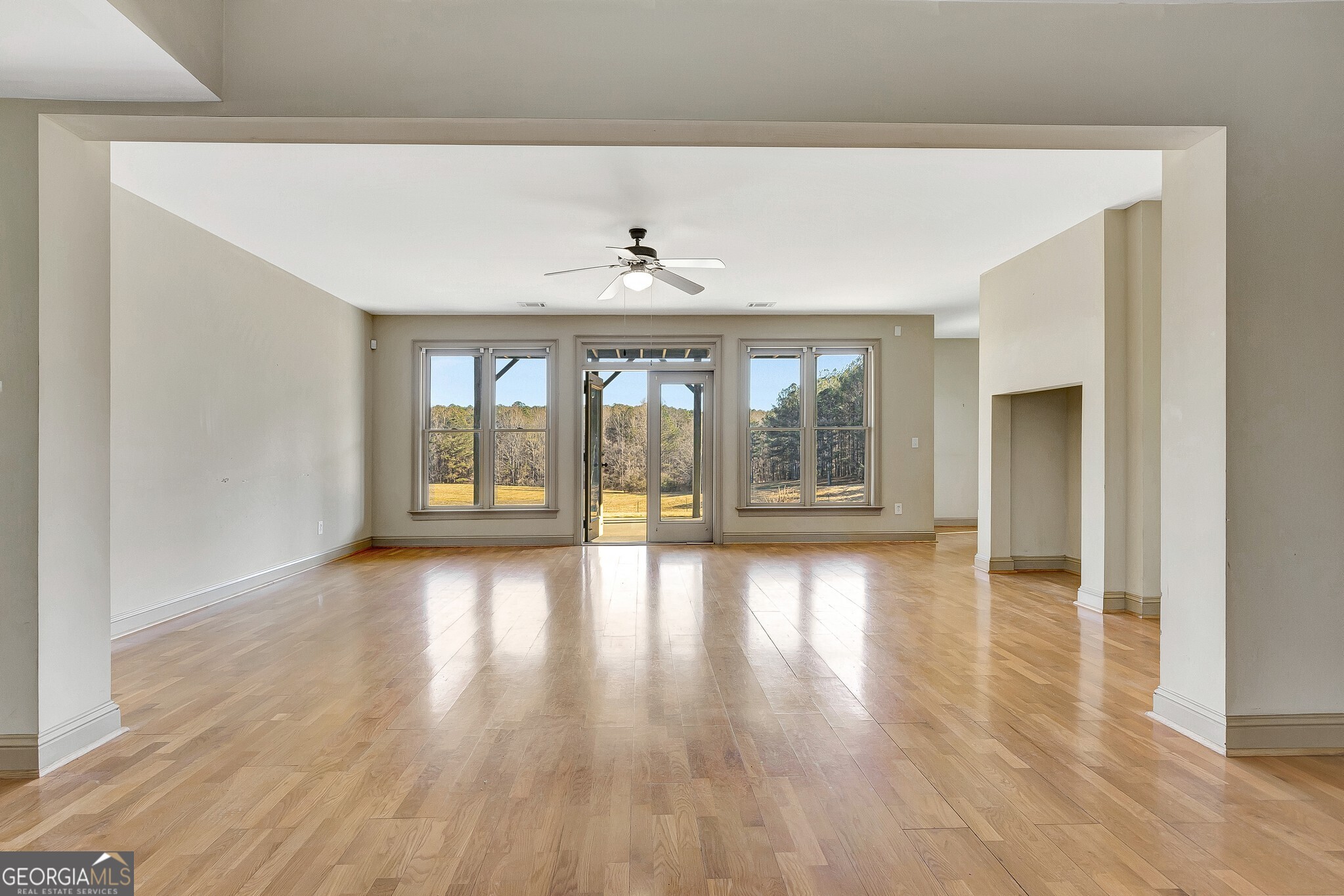 220 Joe Roberts Road Newnan, GA 30263 - Photo 67 of 108 a view of an empty room with wooden floor and a window