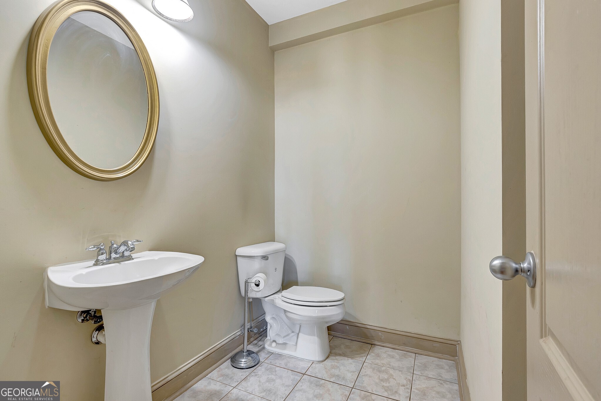 220 Joe Roberts Road Newnan, GA 30263 - Photo 70 of 108 a bathroom with a sink a toilet and a mirror