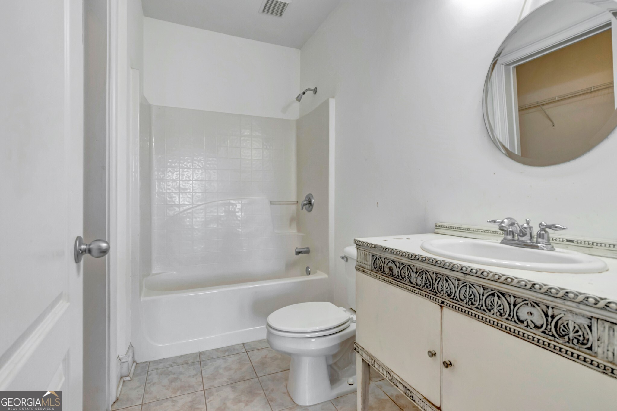 220 Joe Roberts Road Newnan, GA 30263 - Photo 73 of 108 a bathroom with a granite countertop toilet a sink and a mirror