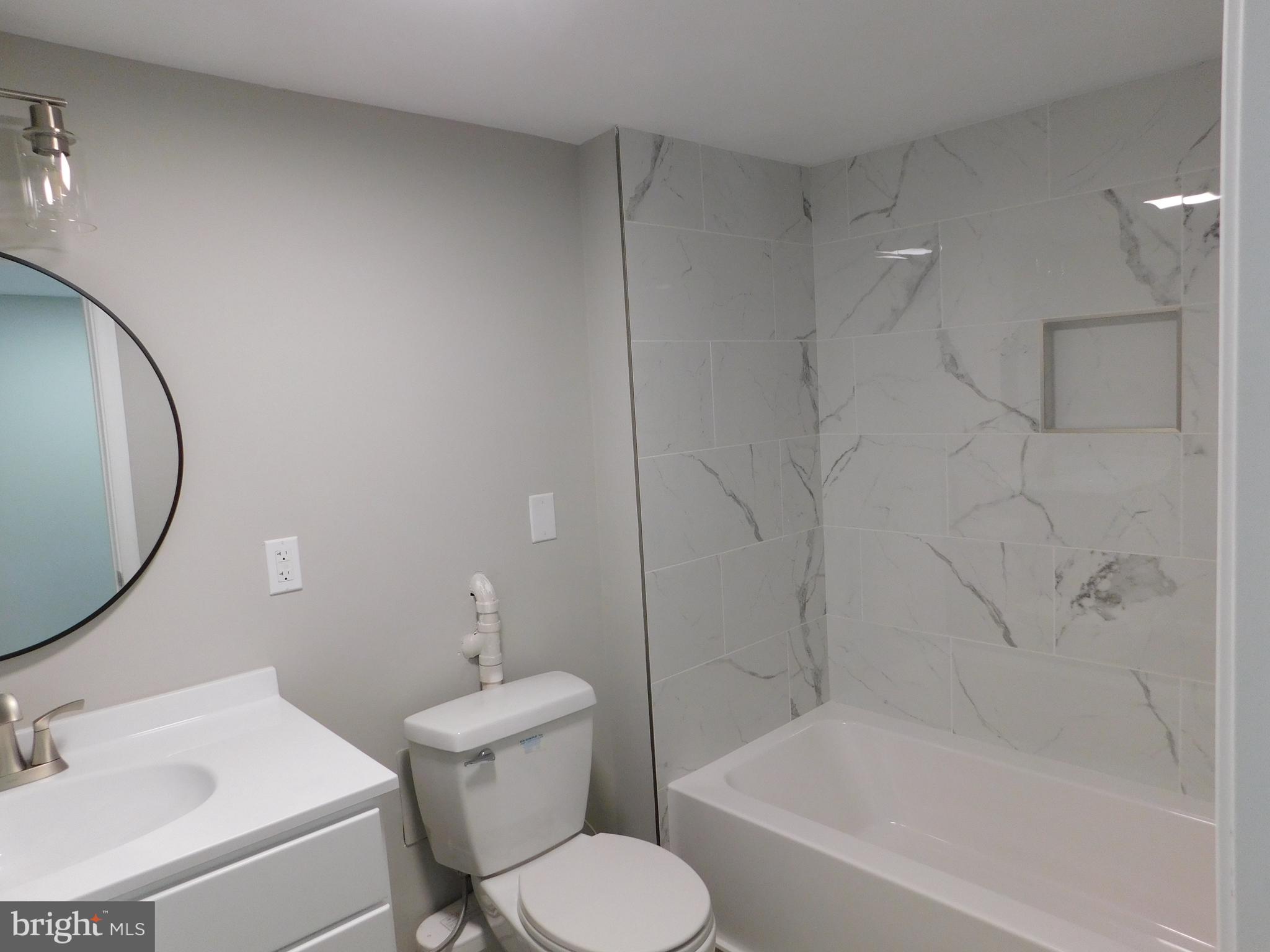 9458 Benson Road Lincoln, DE 19960 - Photo 31 of 38 a bathroom with a sink toilet and shower