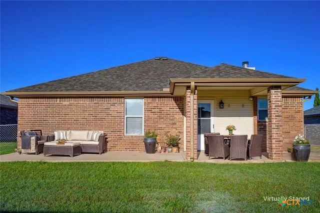 a backyard of a house with seating space