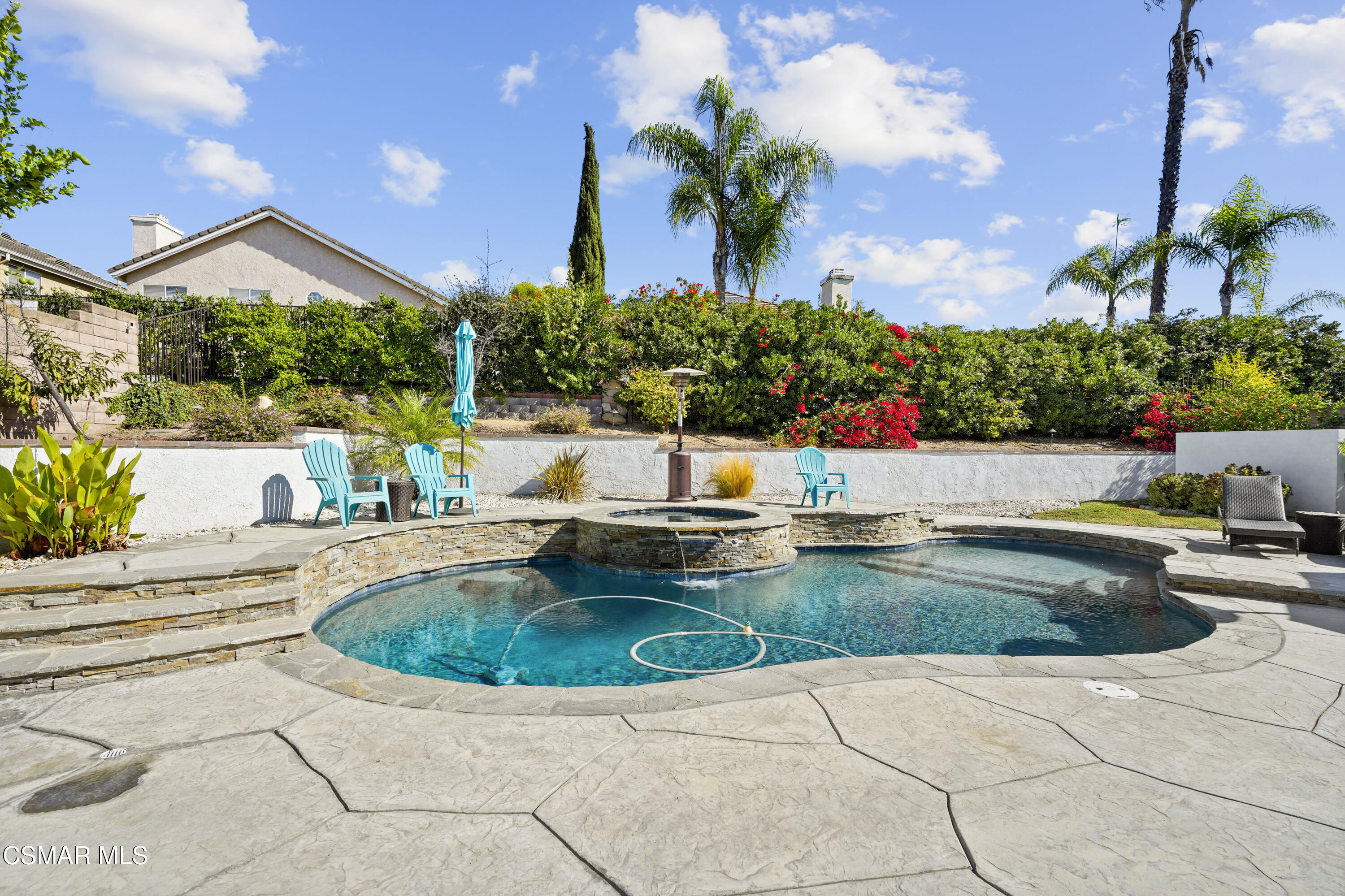 a view of a swimming pool with a patio