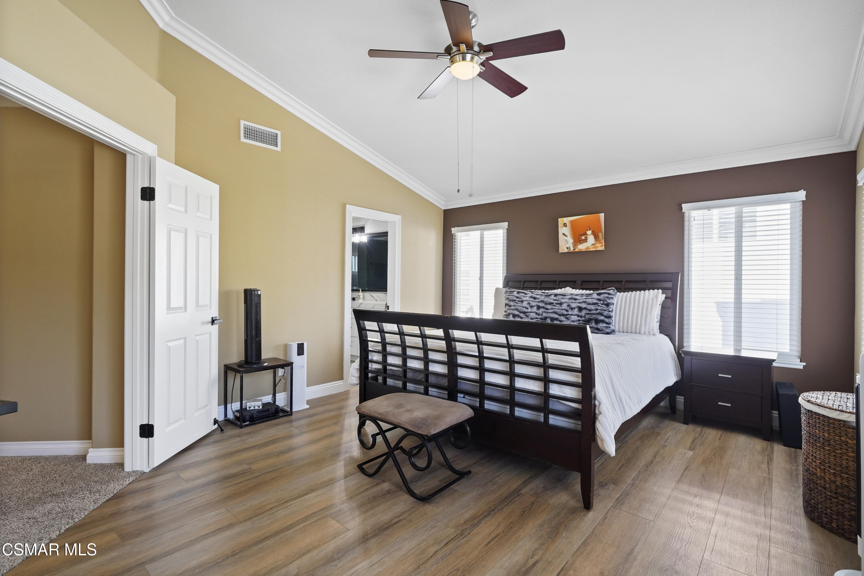 14291 Clemson Street Moorpark, CA 93021 - Photo 11 of 23 a bedroom with a bed and wooden floor