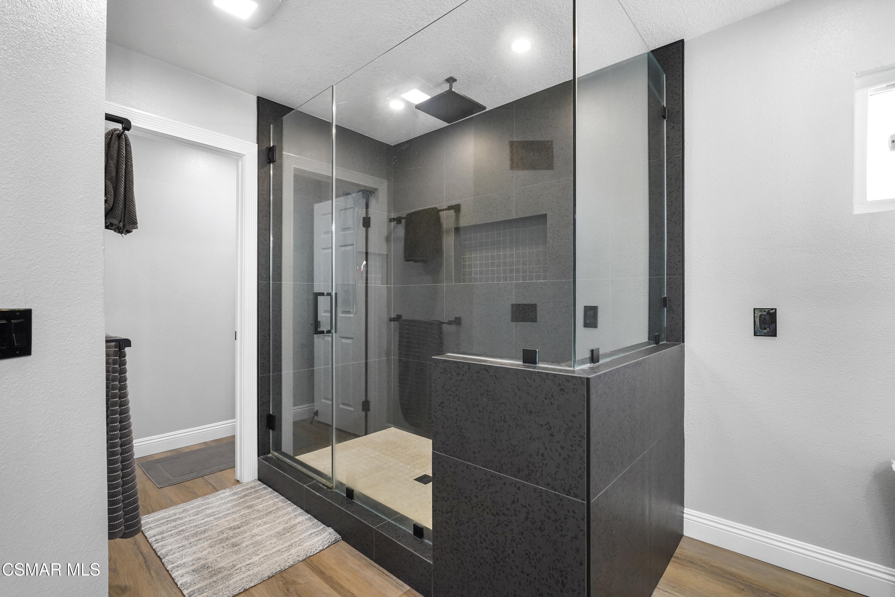 14291 Clemson Street Moorpark, CA 93021 - Photo 13 of 23 a bathroom with a shower and a sink