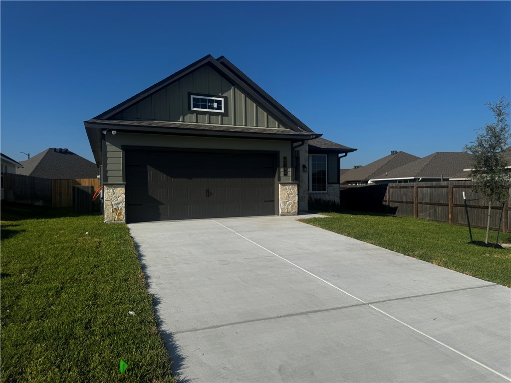 4795 Holm Oak Road Bryan, TX 77845 - Photo 3 of 17 View of front of house featuring stone siding, board and batten siding, and concrete driveway