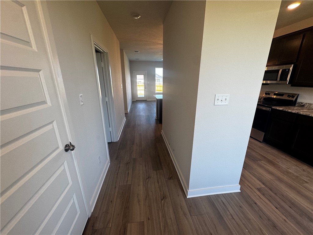 4795 Holm Oak Road Bryan, TX 77845 - Photo 5 of 17 Corridor featuring dark wood-style floors